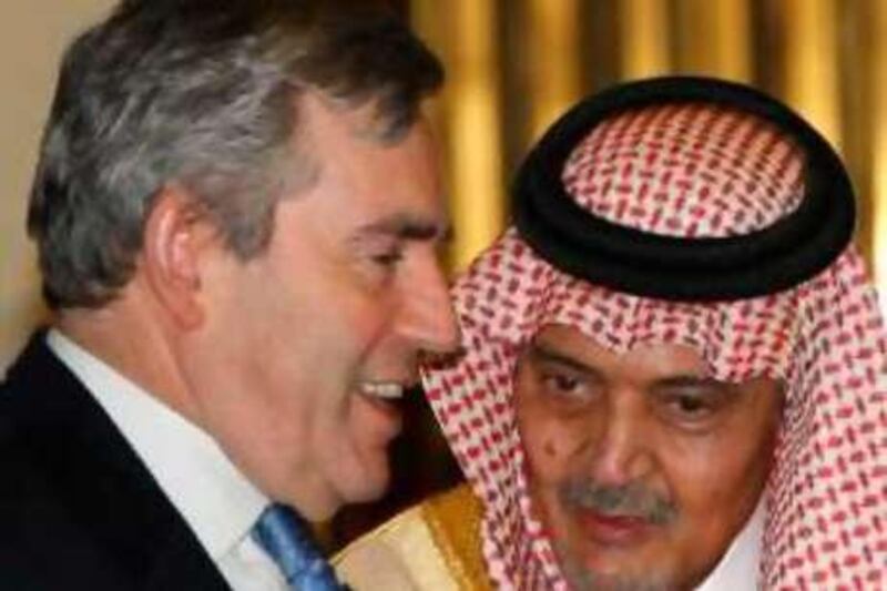 British Prime Minister Gordon Brown, left, speaks with Saudi Foreign Minster Prince Saudi al-Faisal, upon his arrival at King Khaled airport in Riyadh, Saudi Arabia, Saturday, Nov. 1, 2008. (AP Photo/Hassan Ammar) *** Local Caption ***  HAS101_Mideast_Saudi_Arabia_Brown_.jpg *** Local Caption ***  HAS101_Mideast_Saudi_Arabia_Brown_.jpg