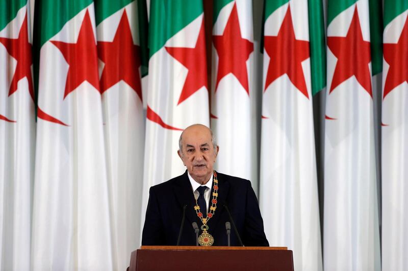 FILE - In this Thursday, Dec. 19, 2019 file photo, Algerian president Abdelmadjid Tebboune delivers a speech during an inauguration ceremony in the presidential palace, in Algiers, Algeria. Algerian President Abdelmadjid Tebboune marks a year in office Saturday but he is nowhere in sight since his evacuation to Germany more than six weeks ago for treatment of COVID-19. (AP Photo/Toufik Doudou, FILE)