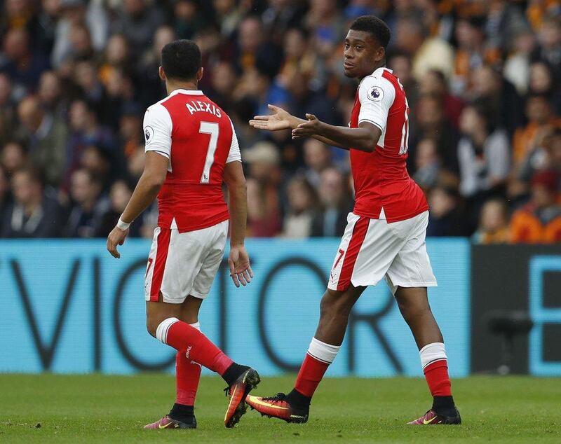 Arsenal’s Alexis Sanchez celebrates with Alex Iwobi after scoring their first goal. Lee Smith / Action Images / Reuters