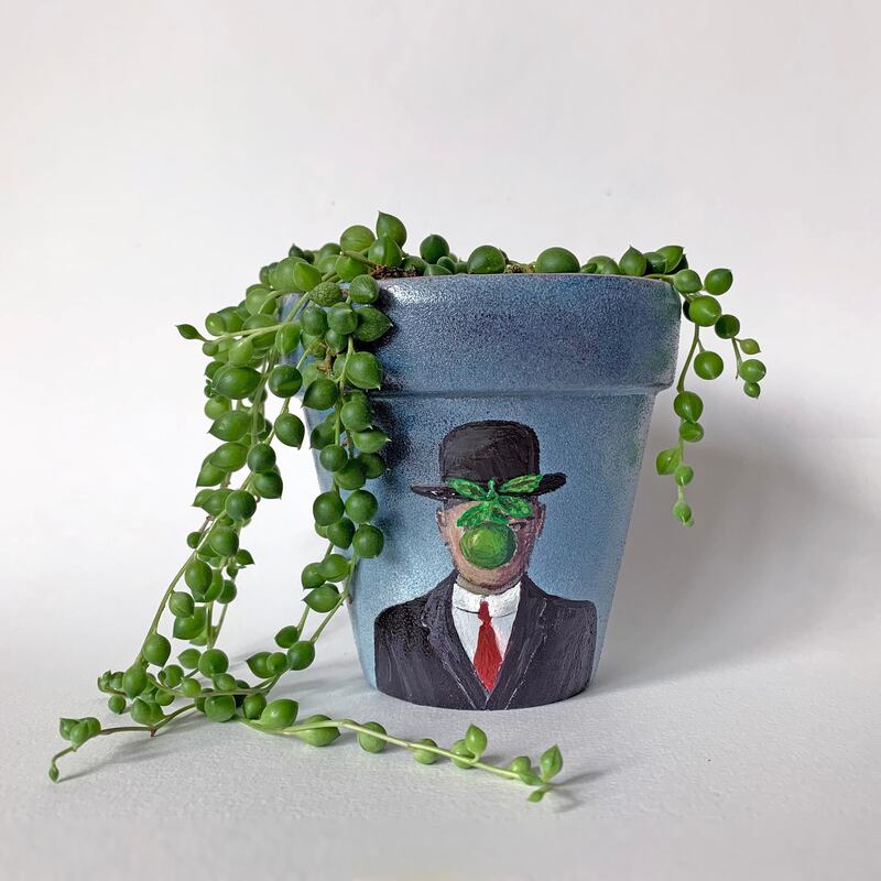 One of the Osipova's plant pots, where she recreates Magritte's 'The Son of Man'