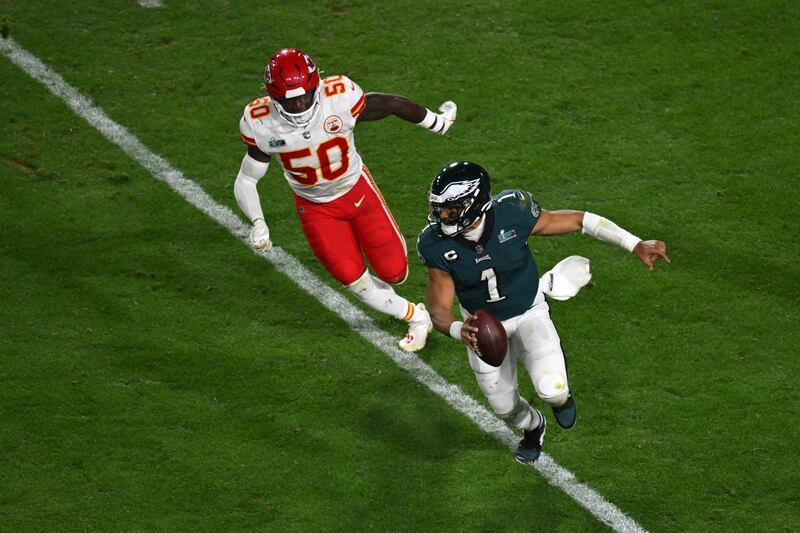 Philadelphia Eagles' quarterback Jalen Hurts runs with the ball during Super Bowl LVII. AFP