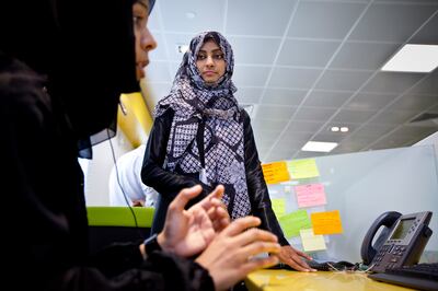 Call center agent, a single mother of two young children, Habeeba al Saqqaf (cq), works at the new Etihad call center in Al Ain on Sunday, March 13, 2011. The phone customer service center provides job opportunities to many local Emirati women from various family backgrounds, and in some cases, such as Ms. Al Saqqaf's, helps them to maintain their financial independence. (Silvia Razgova/The National)