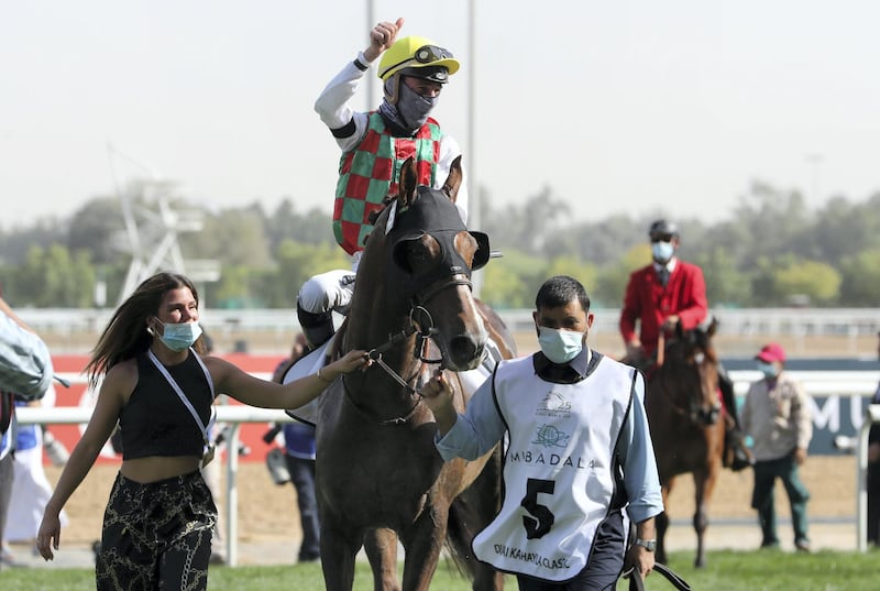 DUBAI , UNITED ARAB EMIRATES , MARCH 27  – 2021 :- DERYAN  (FR) ridden by Loritz Mendizabal ( no 5 ) won the 1st horse race  Dubai Kahayla Classic 2000m dirt  during the Dubai World Cup held at Meydan Racecourse in Dubai. ( Pawan Singh / The National ) For News/Sports/Instagram/Big Picture. Story by Amith