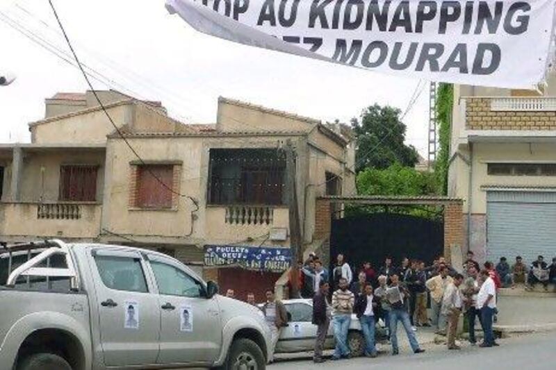 A car features a poster of Mourad Bilek, an 18-year-old youth who was kidnapped in May in the village of Beni-Douala in the northeastern Kabylie region of Algeria. Algerians went on strike and demonstrated in towns in the Kabylie region to protest against the kidnapping.