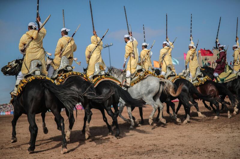A troupe charges holding their rifles before firing, during Tabourida, a traditional horse riding show also known as Fantasia, in the coastal town of El Jadida, Morocco. All photos: AP / Mosa'ab Elshamy