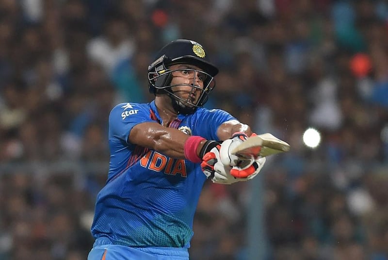 India's Yuvraj Singh plays a shot during the World T20 cricket tournament match between India and Pakistan at the Eden Gardens cricket stadium in Kolkata on March 19, 2016. / AFP / Prakash SINGH