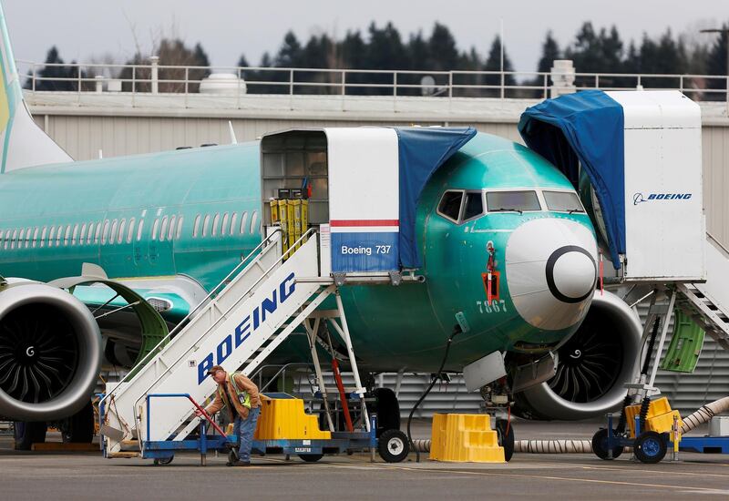 FILE PHOTO: An employee works near a Boeing 737 Max aircraft at Boeing's 737 Max production facility in Renton, Washington, U.S. December 16, 2019. REUTERS/Lindsey Wasson/File Photo