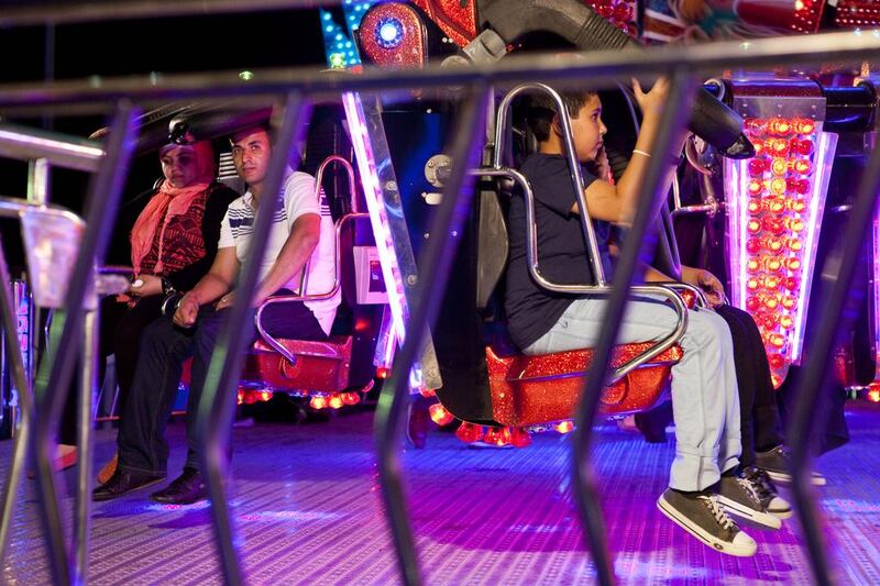 Visitors enjoyed the fun fair at Global Village. Razan Alzayani / The National