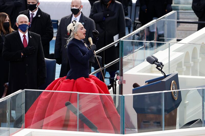 Lady Gaga and U.S. Vice President Mike Pence during the National Anthem during the inauguration of Joe Biden as the 46th President of the United States on the West Front of the U.S. Capitol in Washington, U.S., January 20, 2021. REUTERS/Brendan McDermid