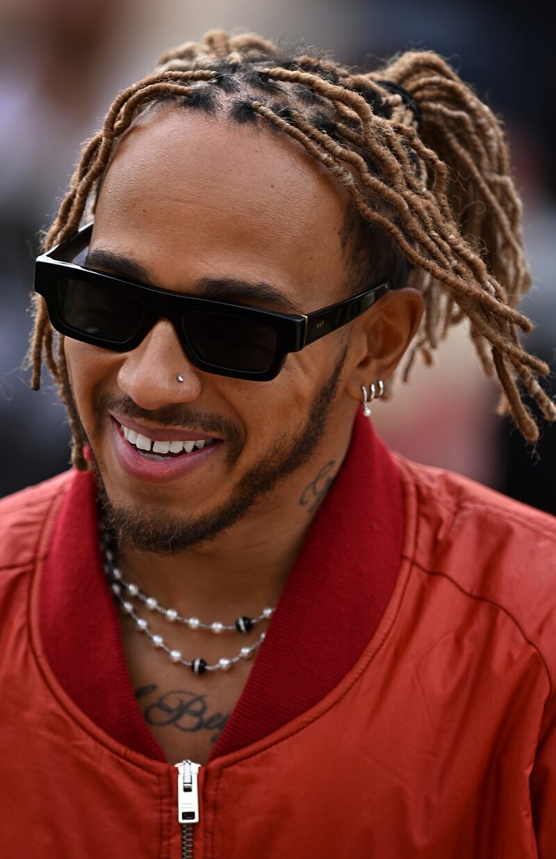 Mercedes star Lewis Hamilton walks in the Paddock ahead of the F1 season opener in Bahrain. Getty