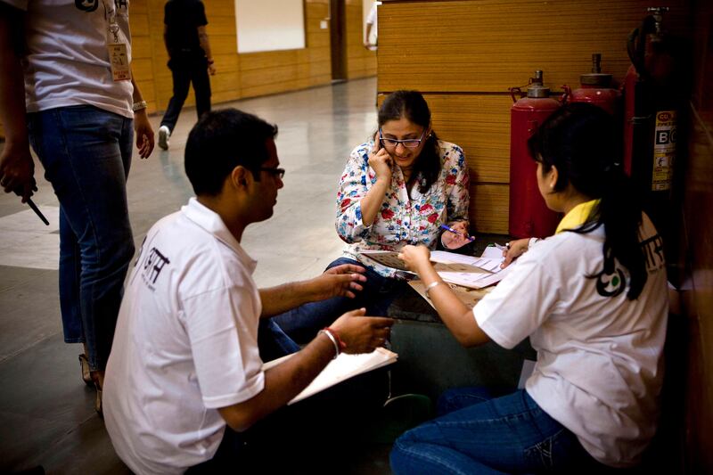 The judges' marks are tallied backstage to decide the finalists at the inaugural AAS Housewives Awards 2012 on 19th May 2012 in New Delhi, India. Photo by Suzanne Lee for The National