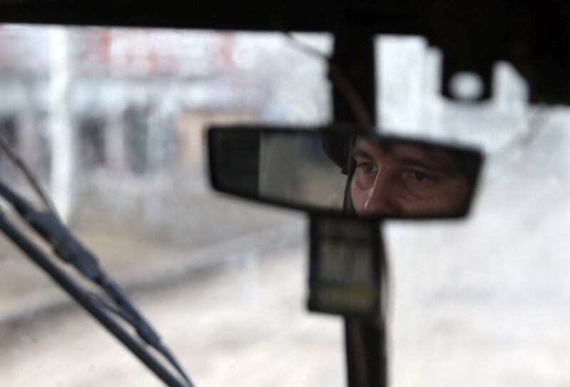 A Ukrainian soldier drives through the town of Bakhmut, in the eastern Donetsk region, where fighting with Russia has intensified. AFP