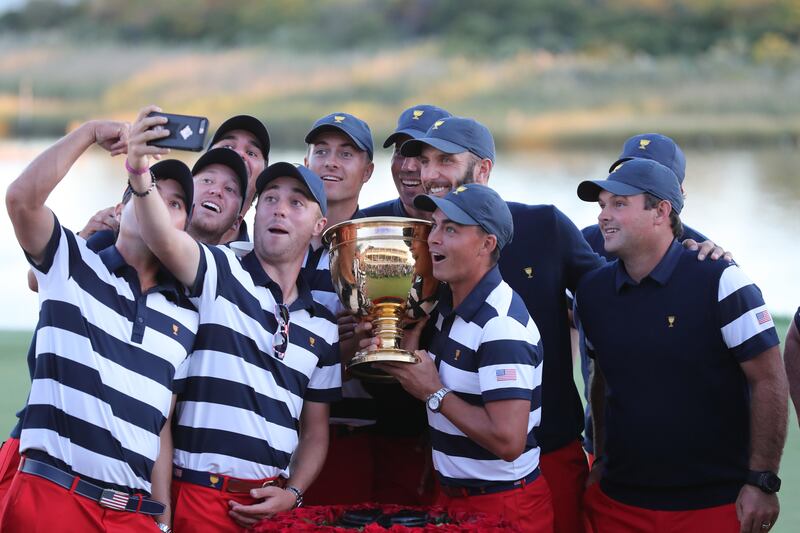 Oct 1, 2017; Jersey City, NJ, USA; The U.S. team pose for a selfie after defeating the International team in the final round singles matches of The President's Cup golf tournament at Liberty National Golf Course. Mandatory Credit: Bill Streicher-USA TODAY Sports