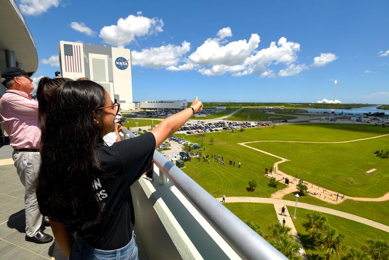 Al Mansoori watches a SpaceX Falcon 9 rocket launch from Kennedy Space Center carrying her Genes in Space experiment to the International Space Station on Aug. 14, 2017 in {town}, Florida. 
(Scott A. Miller for The National)
