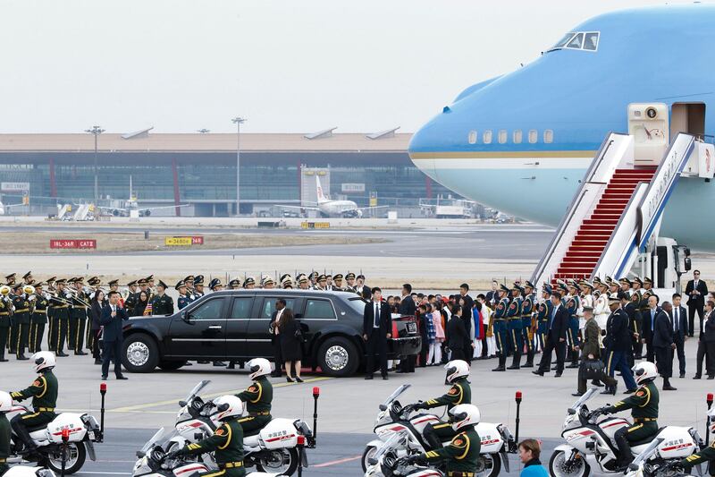 US president Donald Trump and first lady Melania Trump depart from the tarmac after their arrival at the Beijing Capital International Airport in China. Thomas Peter / EPA