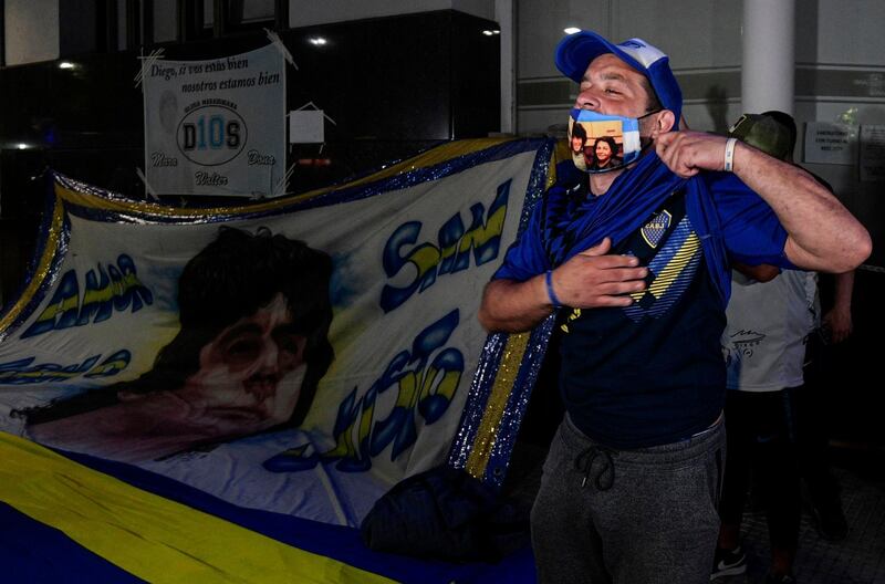 Supporters of Diego Maradona gather outside the hospital where he undergoes a brain surgery for a blood clot, in Olivos, Buenos Aires. AFP