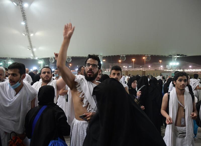 Muslim worshippers throw pebbles as part of the symbolic al-A'qabah (stoning of the devil ritual) at the Jamarat Bridge during the Hajj pilgrimage in Mina, near Makkah, Saudi Arabia.  AFP