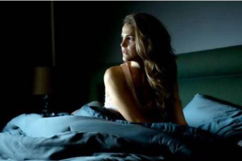Keri Russell stars as a suburban wife living in a mysterious house. Courtesy Alliance Films