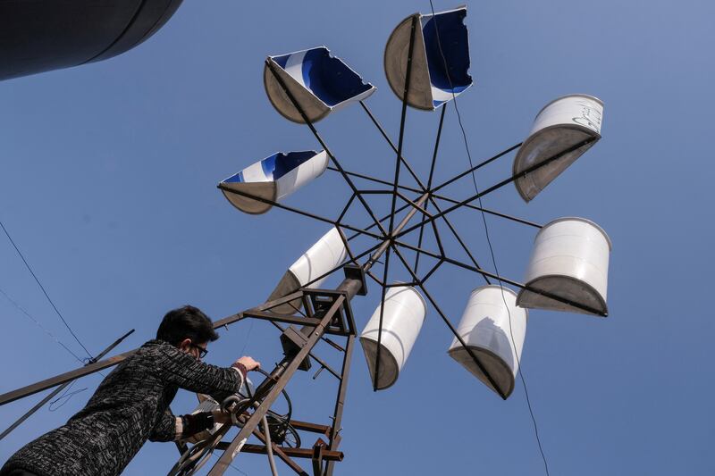 Mohamad Sabsabi, 25-year-old works on his wind turbine creation, Green X, to provide alternative energy and illuminate his and some neighbours houses in the northern town of Bebnine, Lebanon, March 1, 2023.  REUTERS / Emilie Madi