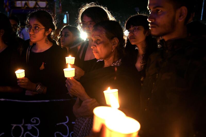 People hold a candlelight vigil in support of sexual assault victims and against the alleged rape and murder of a 27-year-old veterinary doctor in Hyderabad, in Bangalore. AFP