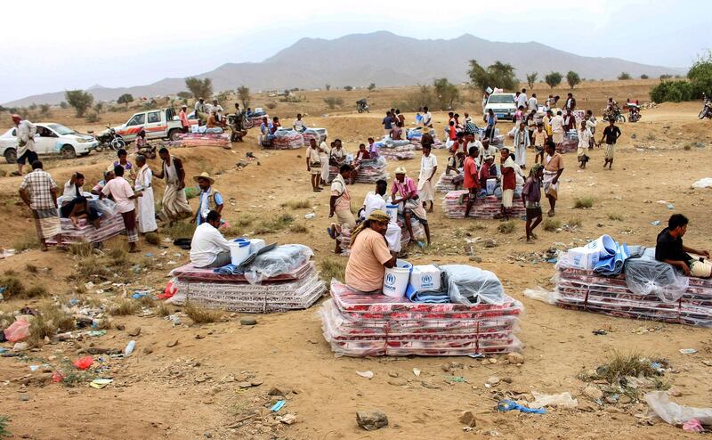 Yemenis displaced from areas near the border with Saudi Arabia receive humanitarian aid given by the Norwegian Refugee Council (NRC) and the UN High Commissioner for Refugees (UNHCR) in the northern province of Hajjah. AFP