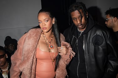 FILE - Rihanna, left, and ASAP Rocky appear at the Off-White Ready To Wear Fall/Winter 2022-2023 fashion collection, in Paris on Feb.  28, 2022.  Now in her third trimester, the music star, and fashion and beauty mogul hasn't exactly been hiding under a maternity tent since she and boyfriend A$AP Rocky announced they were expecting.  She's made the fashion week rounds in Milan and Paris wearing a range of couture that shows off her belly.  (Photo by Vianney Le Caer / Invision / AP, File)