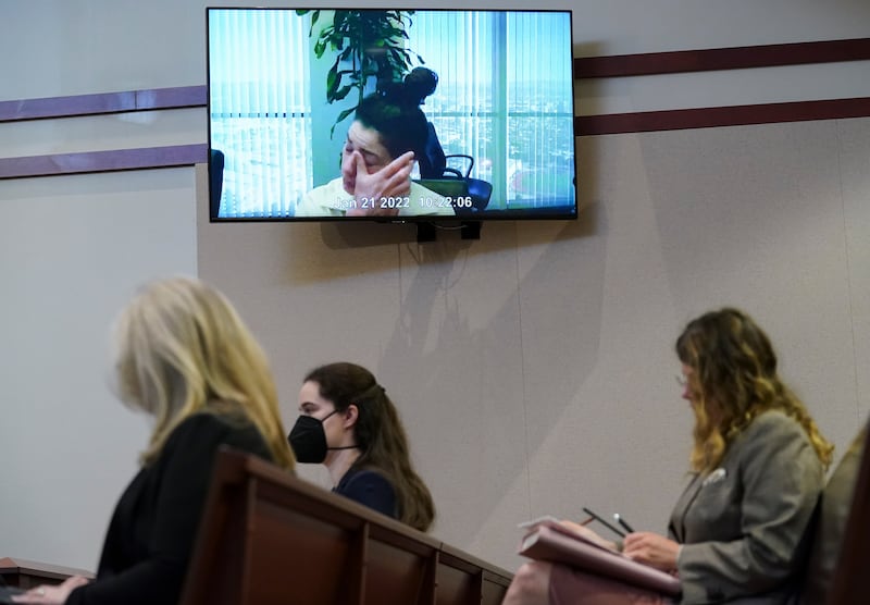 Pennington on screen above the spectators in the Virginia courtroom. EPA