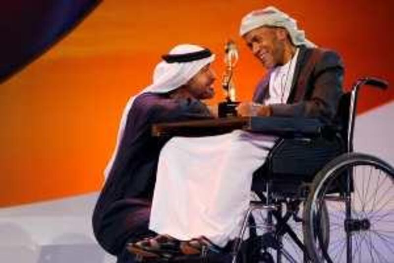 ABU DHABI, UNITED ARAB EMIRATES - February 14, 2010: The 2010 Abu Dhabi Awards at Emirates Palace.
His Highness Sheikh Mohamed bin Zayed Al Nahyan awarding Saleh Salem Al YaÕrabi
( Ryan Carter / EAA ) 

