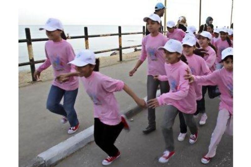 A reader objects to Hamas's decision to bar women from running in the Gaza marathon, in which many young girls participated in when the event was launched in 2011. Adel Hana / AP Photo