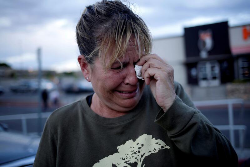 A woman reacts after a mass shooting at a Walmart in El Paso, Texas. Reuters