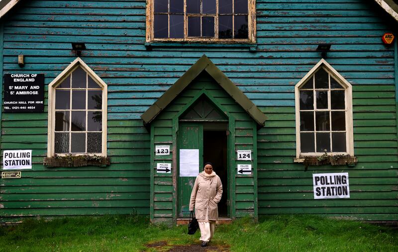 A lady leaves a polling station during local elections in Birmingham, Britain. Reuters