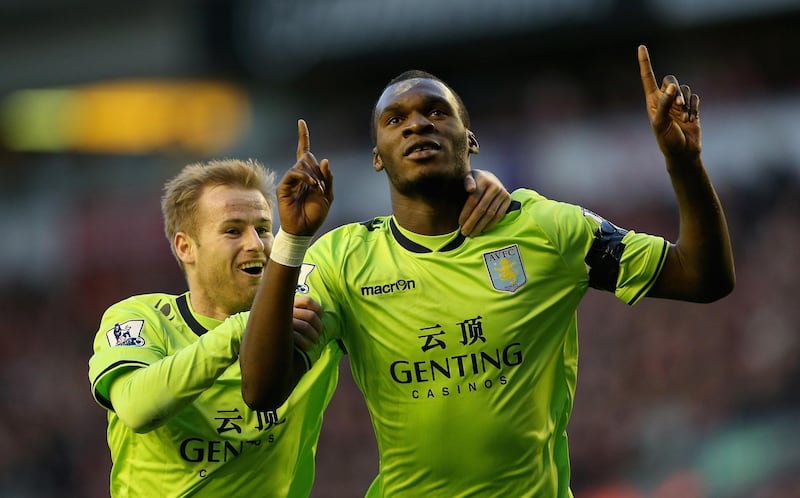 LIVERPOOL, ENGLAND - DECEMBER 15:  Christian Benteke of Aston Villa celebrates after scoring the first goal with team mate Barry Bannan during the Barclays Premier League match between Liverpool and Aston Villa at Anfield on  December 15, 2012 in Liverpool, England.  (Photo by Clive Brunskill/Getty Images)