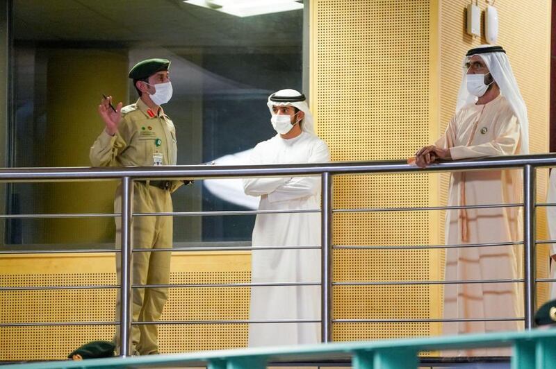 Sheikh Mohammed is given a tour by a Dubai Police official.