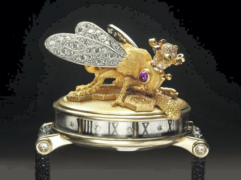 The Queen Bee watch for the Dowager Queen of Morocco is executed in textured 18K yellow gold, the body is decorated with canary yellow diamonds and the wings encrusted with white diamonds. The bee has ruby cabochon eyes, wears a multi-gem-encrusted crown and hovers over yellow and white pave diamond honey cells, by gemstone artist Andreas von Zadora-Gerlof