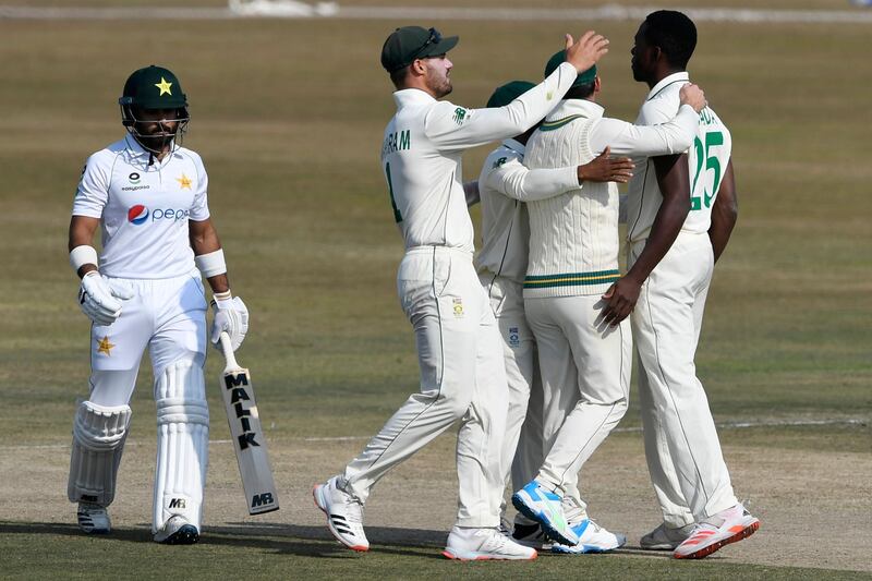 South Africa's Kagiso Rabada, right, celebrates with teammates after taking the wicket of Pakistan opener Imran Butt  for a duck. AFP