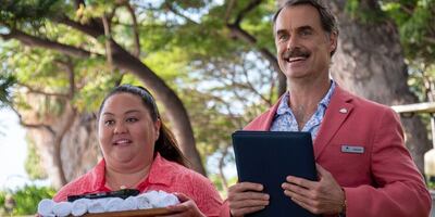 Jolene Purdy, left, and Murray Bartlett are the Maui hotel staff charged with being 'mommies' to their rich, pampered guests, as one meanders unwittingly towards the grave in 'The White Lotus'. Photo: HBO