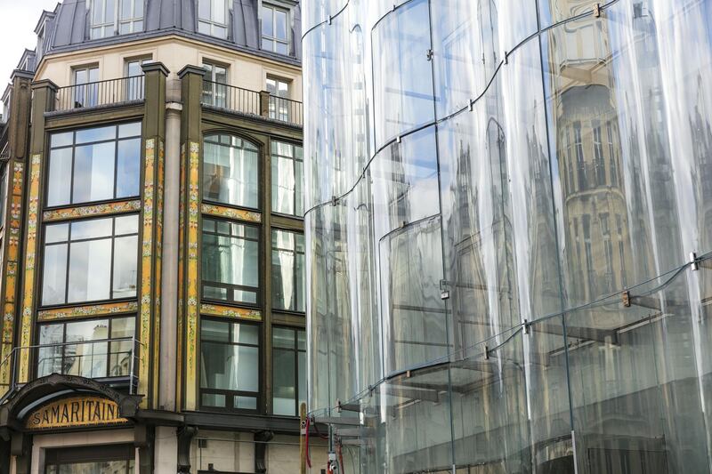 A curved glass facade covers the Samaritaine department store, operated by LVMH Moet Hennessy Louis Vuitton, during ongoing renovation work in Paris, France, on Tuesday, Nov. 19, 2019. The world’s biggest luxury group LVMH, controlled by billionaire Bernard Arnault--is set to reopen the Samaritaine department store next April after 15 years. Photographer: Laura Stevens/Bloomberg