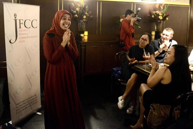 Indonesian comedian Sakdiyah Maruf performing in Jakarta as she reels off taboo-breaking jokes to laughter from a rapt audience. As a female Muslim stand-up, she challenges prejudice against women and rising religious intolerance. Goh Chai Hin / AFP