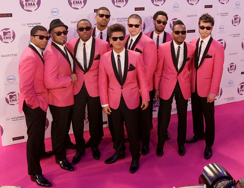 Bruno Mars and his band in matching pink tuxedos at the 2011 MTV Europe Music Awards. Getty 