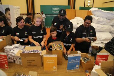 Volunteers pack the back to school kits for distribution to disadvantaged children in the UAE