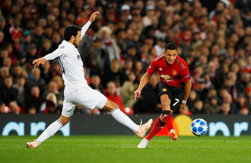 Manchester United's Alexis Sanchez in action with Valencia's Dani Parejo. Reuters