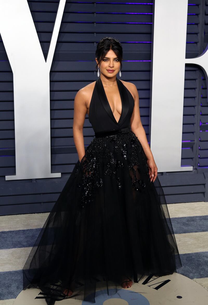 epa07396033 Priyanka Chopra poses at the 2019 Vanity Fair Oscar Party following the 91st annual Academy Awards ceremony, in Beverly Hills, California, USA, 24 February 2019. Black dress by Elie Saab Haute Couture. The Oscars are presented for outstanding individual or collective efforts in 24 categories in filmmaking.  EPA-EFE/NINA PROMMER