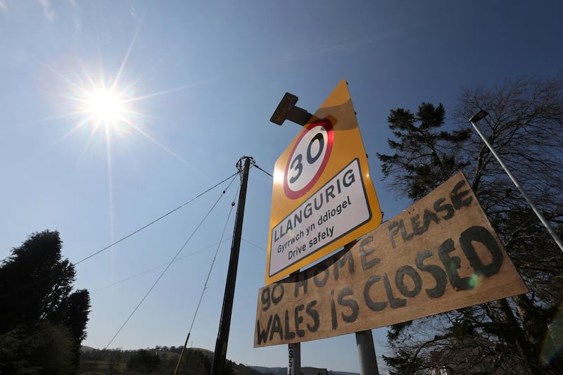 A sign is seen in Aberystwyth, as the spread of coronavirus continues, Wales. Reuters