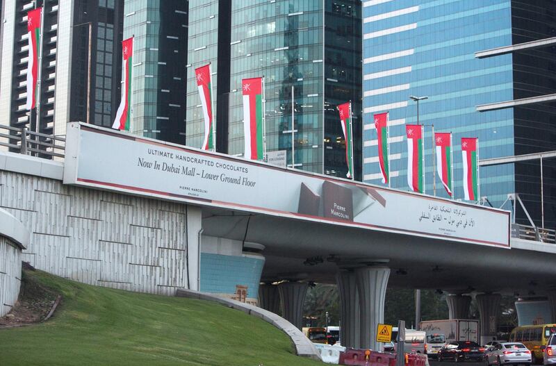 Dubai, United Arab Emirates- Omani flags on display at Sheikh Zayed Road roundabout.  Leslie Pableo for The National
