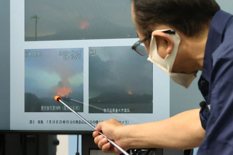 The chief of the unit monitoring volcanoes at the Japan Meteorological Agency explains the eruption during a press conference in Tokyo. AFP