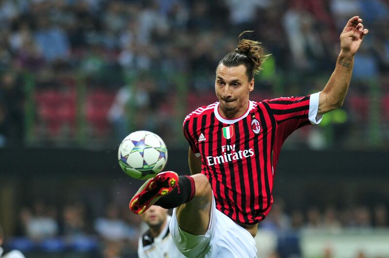 (FILES) In this file photo taken on September 28, 2011, AC Milan's Swedish forward Zlatan Ibrahimovic jumps for the ball against Viktoria Plzen during their Champions League matchday 2 , Group D match at San Siro Stadium In Milan. Swedish star Zlatan Ibrahimovic has signed a six-month contract with Serie A side AC Milan with the option of an additional year, the Italian club said in a statement on December 27, 2019. Ibrahimovic played for two seasons between 2010 and 2012 with Milan, helping them to their last Serie A title. The 38-year-old left Los Angeles Galaxy last month following the club's elimination from the Major League Soccer playoffs. / AFP / Giuseppe CACACE
