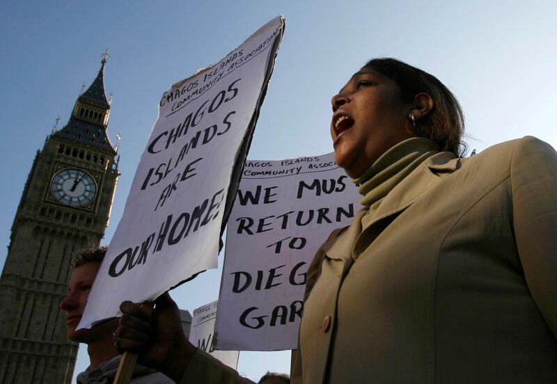 FILE PHOTO: FILE PHOTO: A demonstrator demanding her return to the Chagos Islands in the Diego Garcia archipelago shouts during a protest outside the Houses of Parliament in London October 22, 2008.  REUTERS/Andrew Winning/File Photo/File Photo