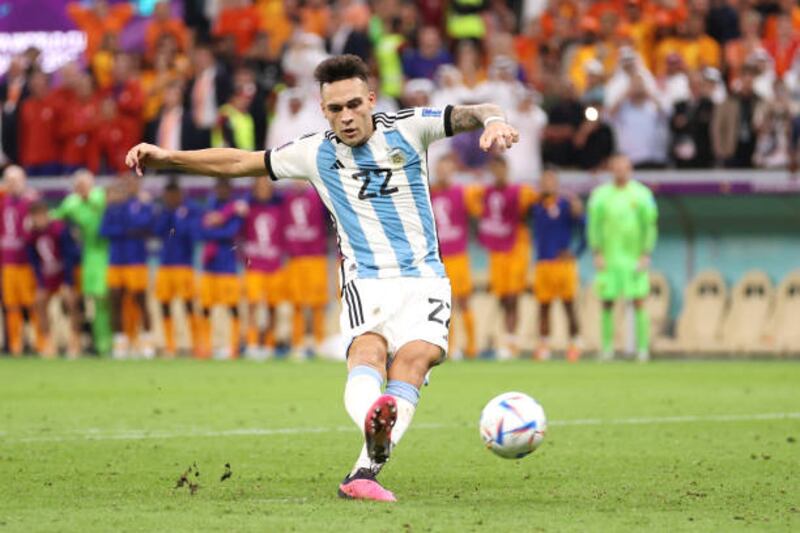 Lautaro Martinez scores the winning penalty for Argentina. Getty