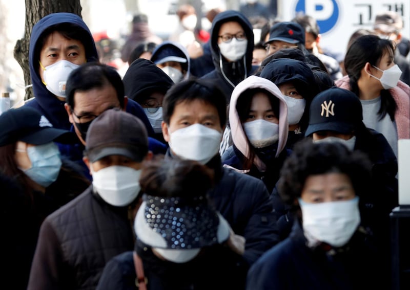 People stand in a long queue to buy face masks at a post office, after a shortage of masks amid the rise in confirmed cases of the novel coronavirus in Daegu, South Korea. Reuters