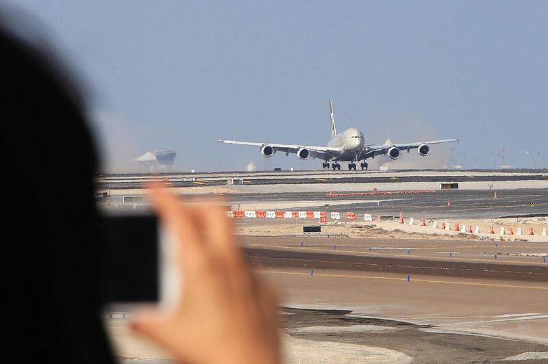 Etihad Airways' Airbus A380 makes its first landing on the new south runway of Abu Dhabi International Airport. Ravindranath K / The National